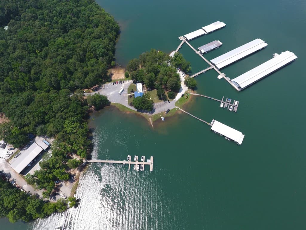 Aerial view of a Lake Hartwell marina with covered boat slips near Clemson